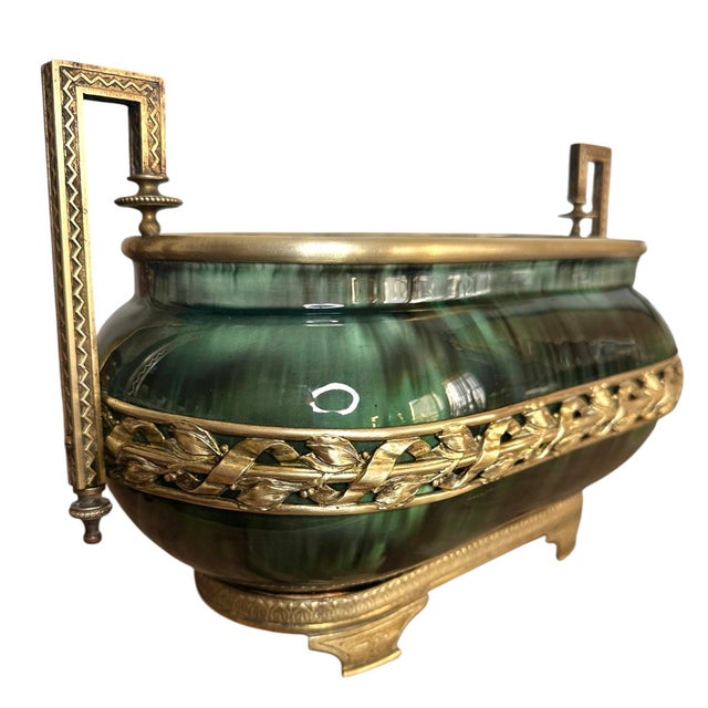 Early 20th century Paul Milet Sèvres jardiniere with deep green flambé glaze and ornate neoclassical bronze mounts. The...