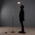 Floor lamp with chromed metal base and structure and adjustable glass diffuser. This piece is attributed to the mentioned...