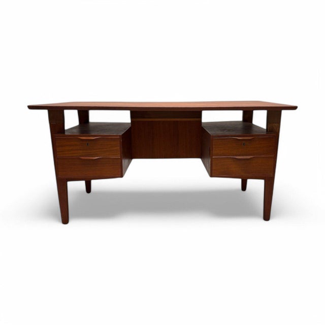 Teak desk by the renowned designer Henning Jorgensen for Fredericia Mobelfabric in the 1960s. This Danish-designed, Mid-...