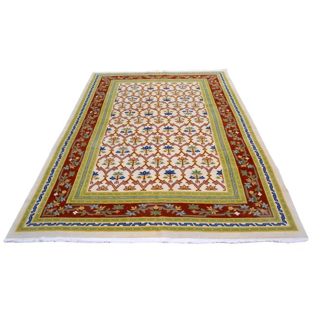 Hand-knotted with care using traditional rug-making techniques, this wool rug blends timeless craftsmanship with a modern...