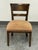 Design Plus Gallery presents a Vintage Ladderback Wooden Side Chair. The sturdy wood frame has tapered legs and a padded...