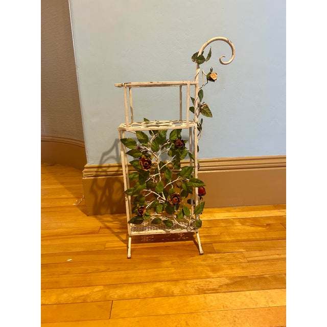 Fabulous floral umbrella stand. This piece is charming and covered in painted metal flowers. Can be used for canes or...