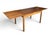 Richly figured teak, ingenious Danish craftsmanship, and effortless versatility make this Mid-Century Modern dining table...