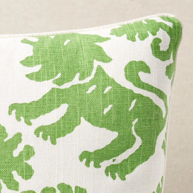 This pillow features Regalia. This artisanal print features mirrored silhouettes of rampant lions and stylized flowers on...