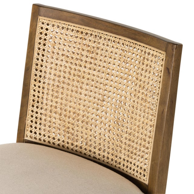 Mixed materials refresh retro stool seating. Light-toasted nettlewood frames a textural inlay of natural cane for a clean,...