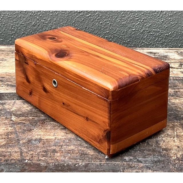 This iconic miniature cedar chest by Lane is a timeless piece of American craftsmanship, originally designed as a "hope...