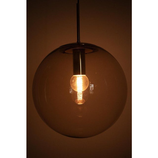 Wonderful xl (40 cm) pendant lamp by glashütte limburg from germany. The lamp is made of beautiful smoke glass with a...