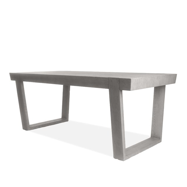 The Antoccino Oak Desk from Restoration Hardware exemplifies minimalist elegance with its architectural silhouette and...