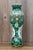 A striking antique Chinese porcelain vase dating to the early 19th century, during the Qing dynasty, and decorated in the...