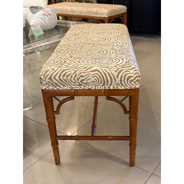 Vintage faux bamboo wood bench with newly upholstered Quadrille fabric. New feet on bottoms. Two available. Dimensions:...