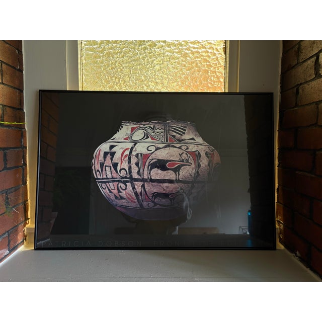 Striking large-scale framed art print by Patricia Dobson for Front Line Editions, featuring a traditional Southwestern...