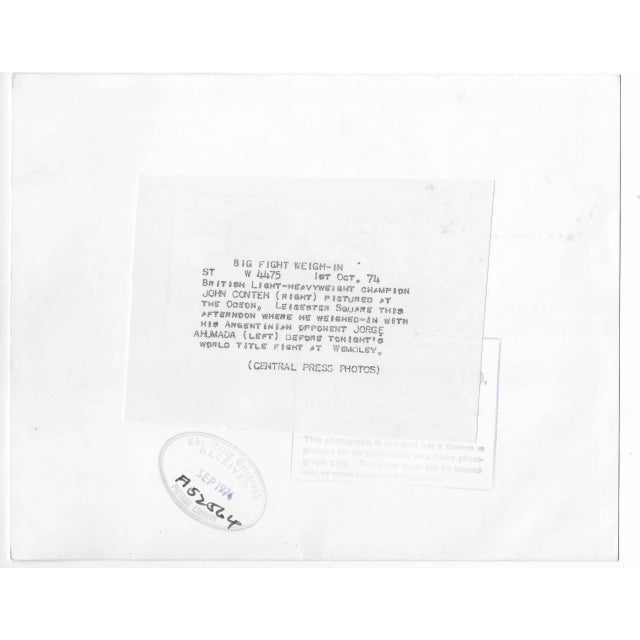 1974 black and white photograph of John Conteh and Jorge Ahumada before a match. Publication information on the back.