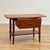 Side table manufactured in Danmark in the 1950s-60s by. It is made of teak wood on the structure and teak on the top...