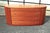 Italian modern credenza or dresser by Doimo, circa 1990, featuring a beautifully curved case, warm cherry wood veneer,...