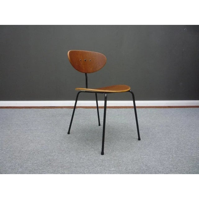 Beautiful chair by Hans Bellmann. Rare and very Early execution in Teak. Metal frame was newly powder coated. Very good...