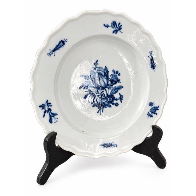 An elegant antique Meissen porcelain soup plate featuring the historic Blaue Blume mit Insekten (Blue Flower with Insects)...