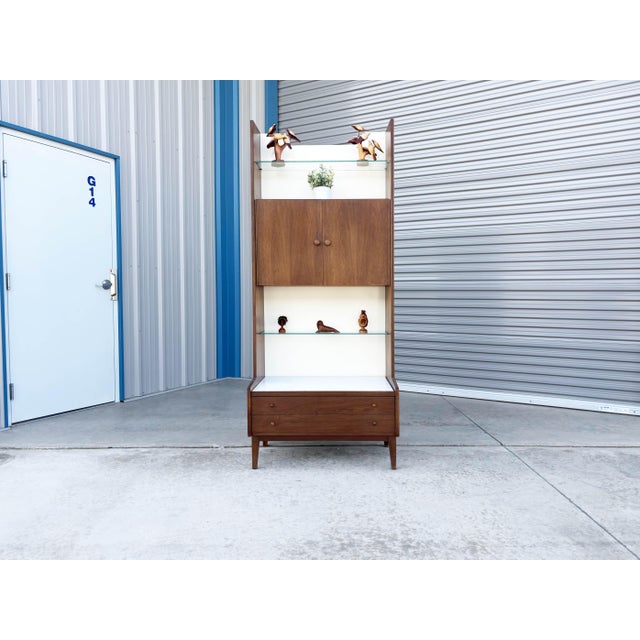 This exceptional Mid-Century Modern walnut cabinet, designed by Kipp Stewart, was crafted in the United States during the...