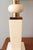 A Modernist marble table lamp. White and ivory colored marble with patinated brass details.