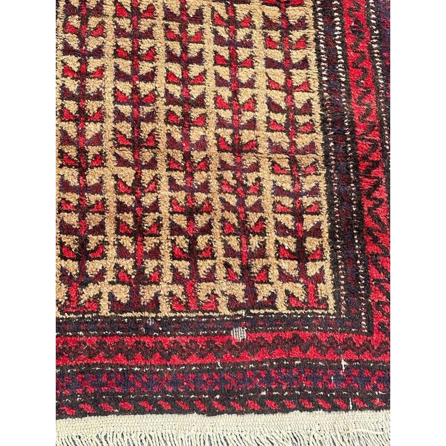 Pretty mid century Turkmen Baluch rug with a stylized designs and nice colours with a yellow field, red, brown, purple,...