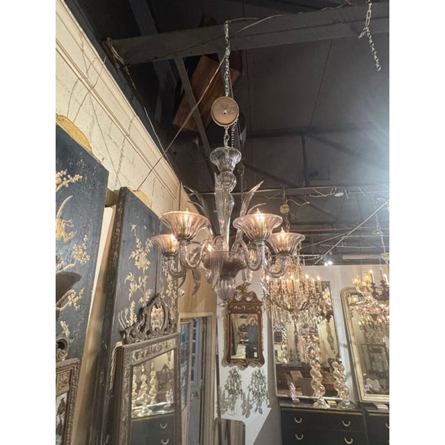 The Modern Fume’ Murano Glass Chandelier is a stunning and elegant lighting fixture . Featuring curved arms and leaf forms...