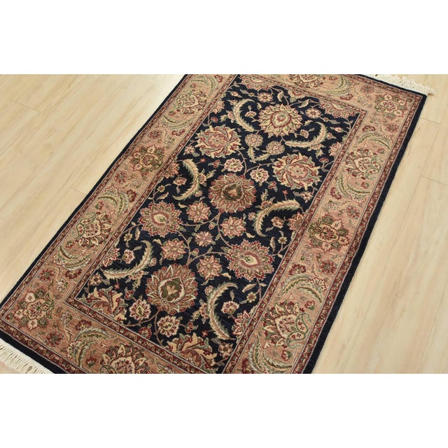 A traditional Tabriz rug hand-knotted with an all-wool pile on a cotton foundation. This finely woven oriental rug...