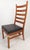 This beautiful set of four vintage modern dining chairs feature high ladder back rests with a sculpted design to ensure...