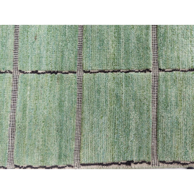 This contemporary Swedish pile rug offers a harmonious marriage of Scandinavian minimalism and tactile luxury. Hand-...