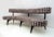 Fully restored curved sofa designed by Vladimir Kagan, originally designed in 1952. It consists of solid ebonized wood...