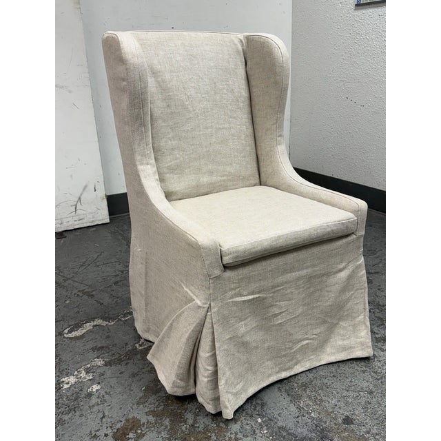 Design Plus Gallery presents the Faye Slipcovered Desk Chair from Restoration Hardware. The chair blends 19th-century...