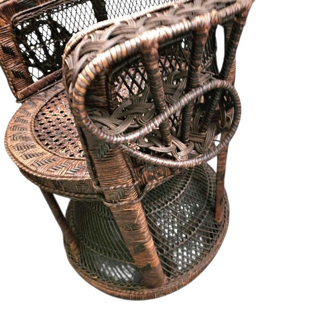 This “Emmanuelle” peacock chair is attributed to the famous furniture company Kok Maison which is known for their bamboo...