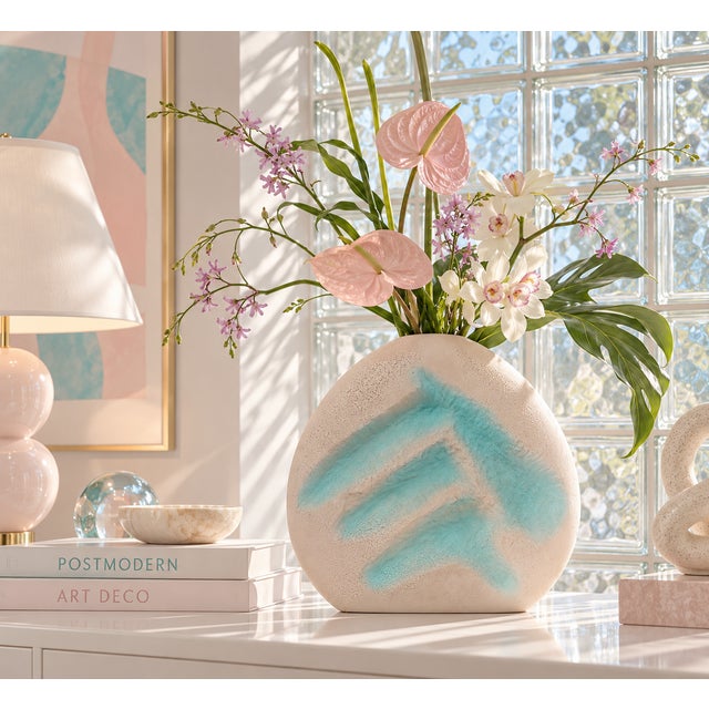 A unique, large-scale postmodern ceramic vase, with a "lava" textured finish, dimensional abstract form, and pink/peach...