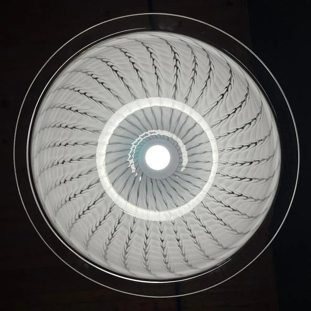 This swirl white Murano pendant lamp was made in Italy in the 1970s. Very beautiful white Murano glass with bends. Perfect...