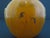 Chinese snuff bottle crafted from an orange-yellow resin material with finely incised and painted pictures depicting...