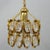 This ceiling light is reminiscent of the designs by Gaetano Sciolari and is made of golden metal and carved crystals. It...