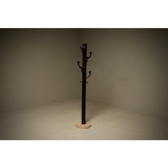 Sculptural coat stand crafted from stained ash wood and travertine, designed in the distinctive style of Ettore Sottsass...