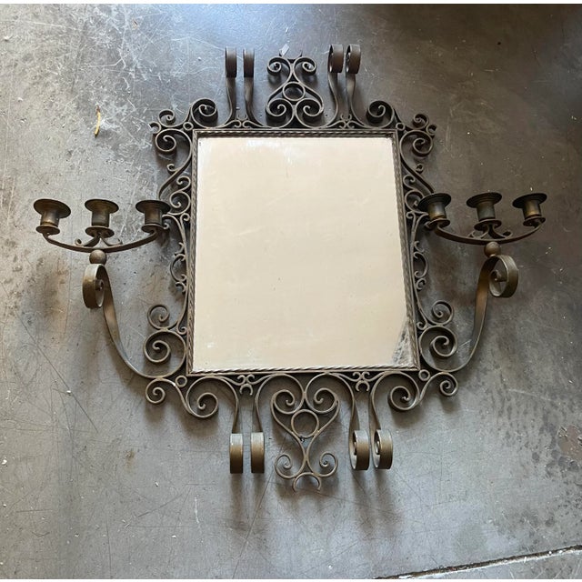 Italian Vintage bronze mirror. Features 6 candle holders. Height 67 cm Width 70 cm