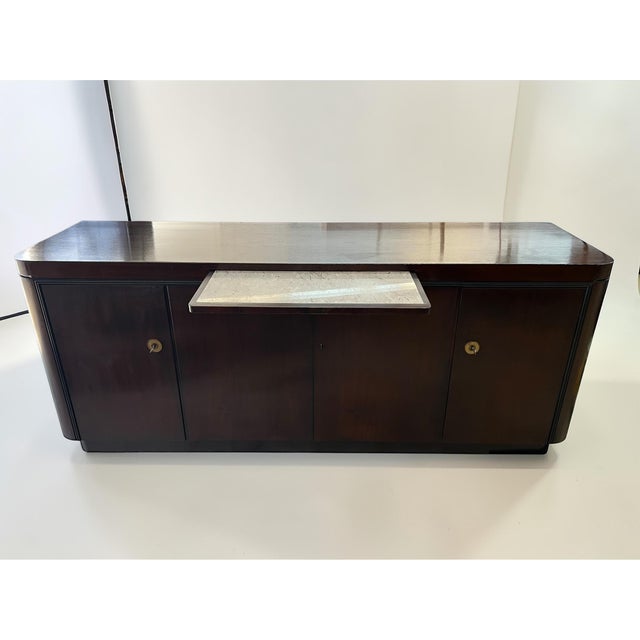 An exceptional, rare sideboard in the style of late Art Deco and Streamline Modernism – a piece of furniture that...