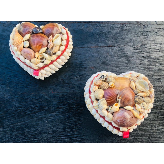 Coastal heart shape seashells encrusted jewelry boxes decorated with a assortment of shells and inside with red felt. No...