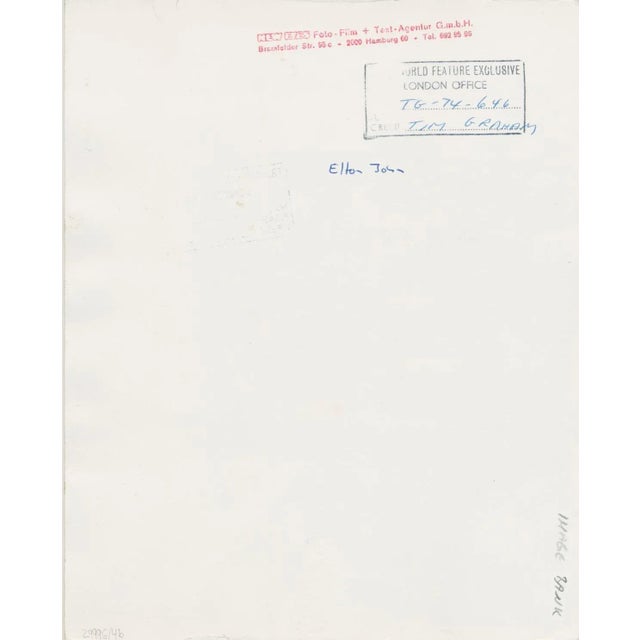 Elton John in a soccer match, Watford FC Shirts, 1973 This piece is attributed to the mentioned designer/maker. It has no...