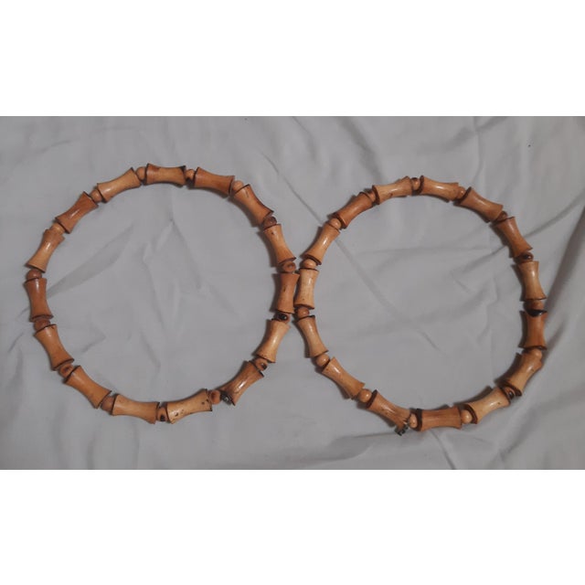 We have two vintage wooden bead hoops that mimic a rattan bamboo look. These can be used as towel holders or purse...