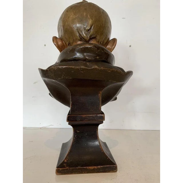 Terracotta Bust Painted bust on a shower foot base Dated or numbered under the base (see photo) Good condition Dimensions:...