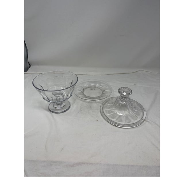 Timeless French glass candy jar that includes a petite plate. This fluted and faceted candy jar works to present your most...