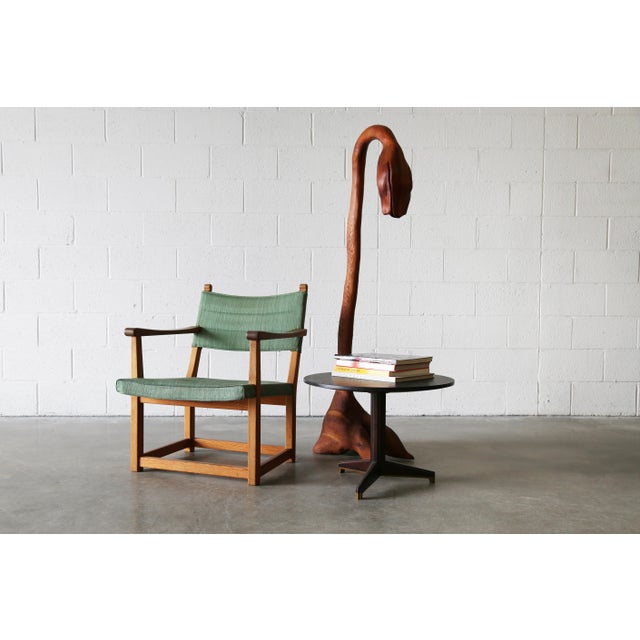 A whimsical wilted flower with an ostrich foot base all out of stack laminated and carved cherry. The bottom of the...