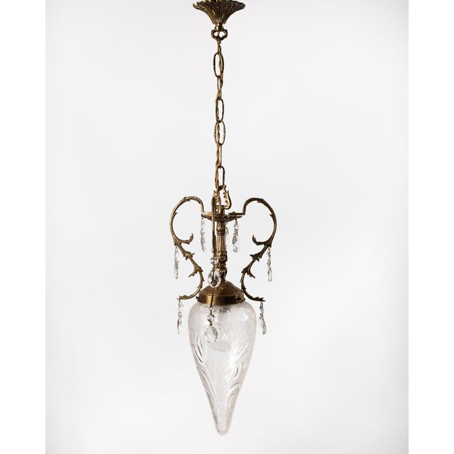 A spectacular and highly elegant vintage pendant light fixture, masterfully crafted in Spain circa 1960. Executed in the...