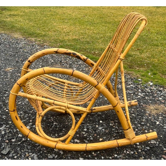 Iconic mid century 1960’s bamboo rocker in the style of Italian designer Franco Albini. Stylized steam bent bamboo with...