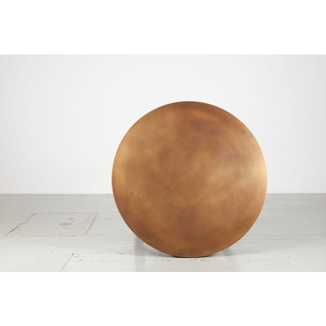 Round wooden table from the 1920s with brass fittings in the table frame and a newly manufactured burnished brass tabletop.