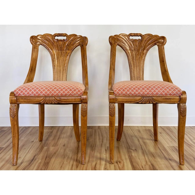 Stunning natural wood elegantly carved chair featuring patterned upholstered seat with piped edging. Chair boasts a...