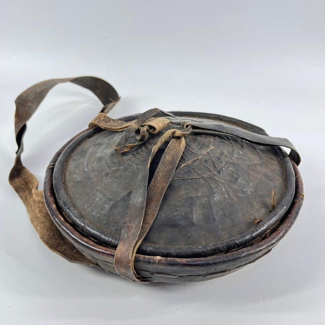 An Ethiopian leather-covered bread basket with a gorgeous patina. Baskets such as this are found among the Oromo and other...