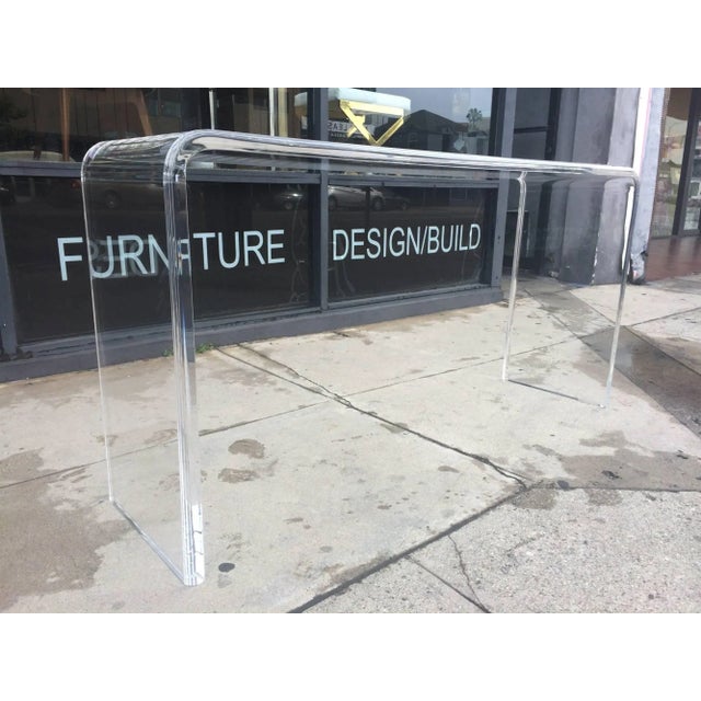 Stunning and beautiful Lucite console designed entirely out of 1.25" thick Lucite and bull-nose edges which gives the...