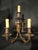 An impressive pair of late 19th century French Renaissance Revival bronze wall sconces featuring dramatic grotesque...